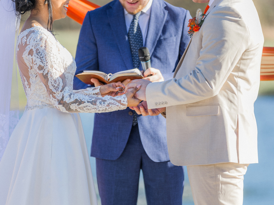 Bride and groom exchanging vows at Cooper's Ridge Wedding Venue, photographed by Love Tree Studios.