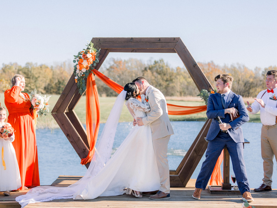 Outdoor ceremony under autumn skies at Cooper's Ridge Wedding Venue, captured by Love Tree Studios.