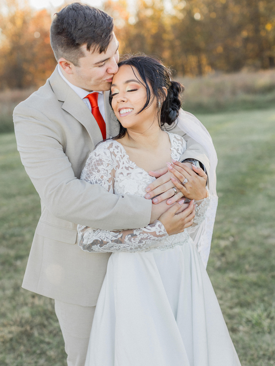 Bryanna and Chase sharing a golden-hour moment at Cooper's Ridge Wedding Venue, photographed by Love Tree Studios.