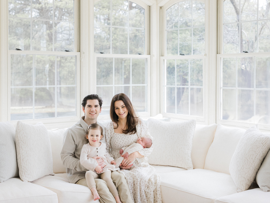 Columbia Missouri Newborn Photographer captures a cozy family moment with baby Harry and his parents - Love Tree Studios.