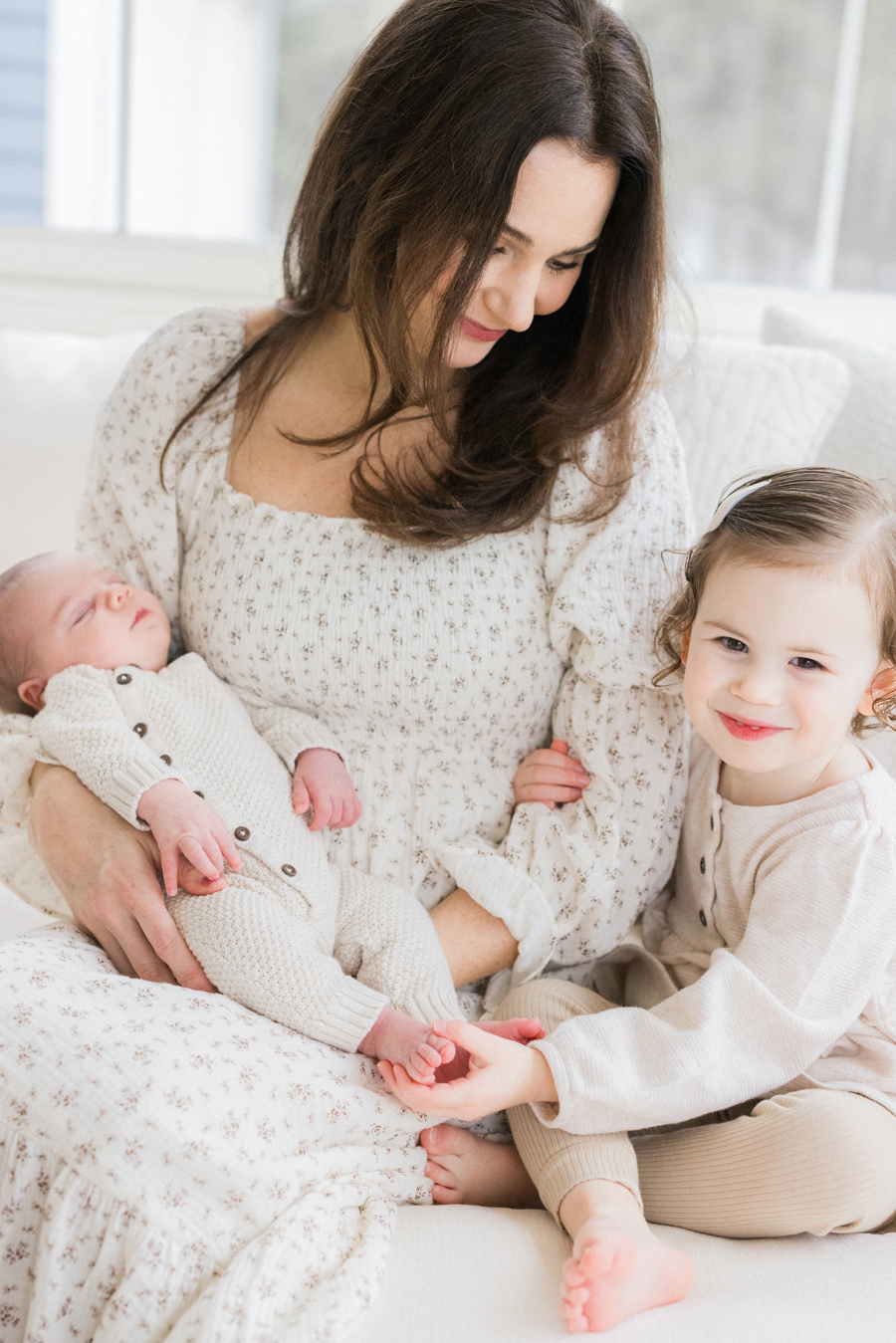 Millie’s laughter fills the air as she cuddles baby Harry, captured by Columbia Missouri Newborn Photographer - Love Tree Studios.