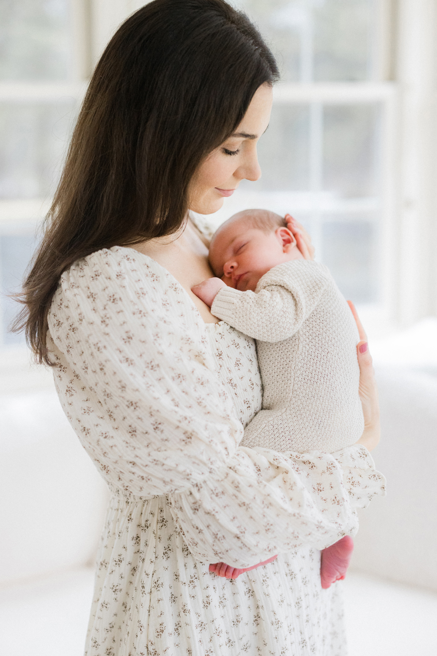 Columbia Missouri Newborn Photographer captures a tender moment between baby Harry and his mom - Love Tree Studios.