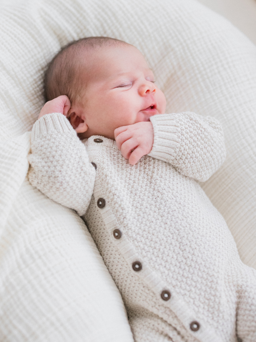 Sweet newborn Harry peacefully sleeping in a cozy home session by Columbia Missouri Newborn Photographer - Love Tree Studios.