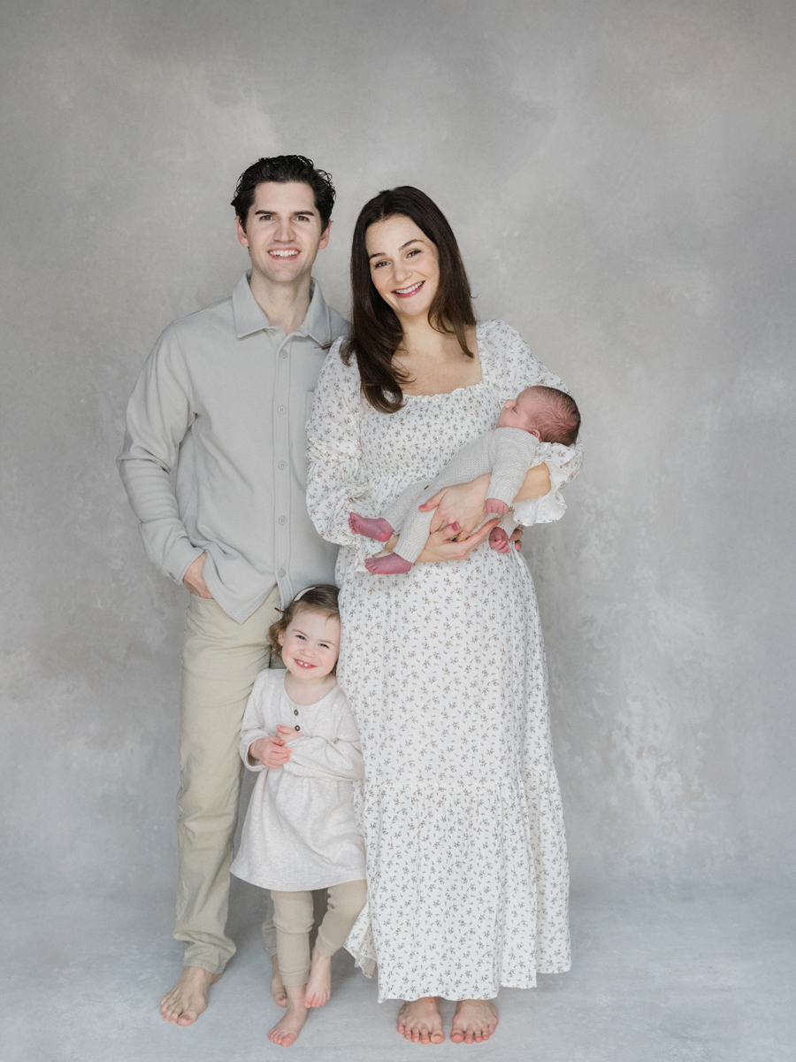 A joyful family moment during baby Harry’s newborn session, captured by Columbia Missouri Newborn Photographer - Love Tree Studios.