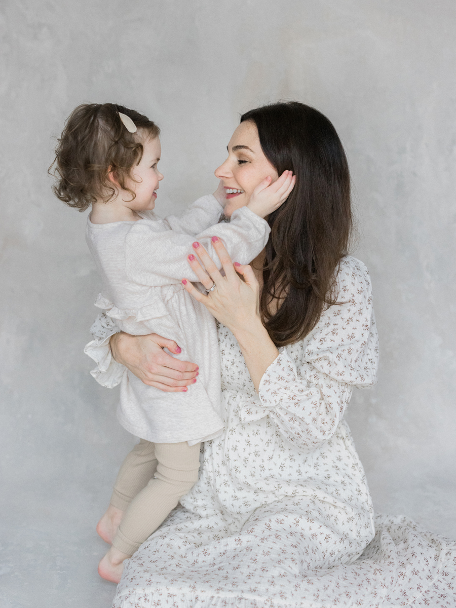 A tender embrace between Millie and her mother, captured by Columbia Missouri Newborn Photographer - Love Tree Studios.