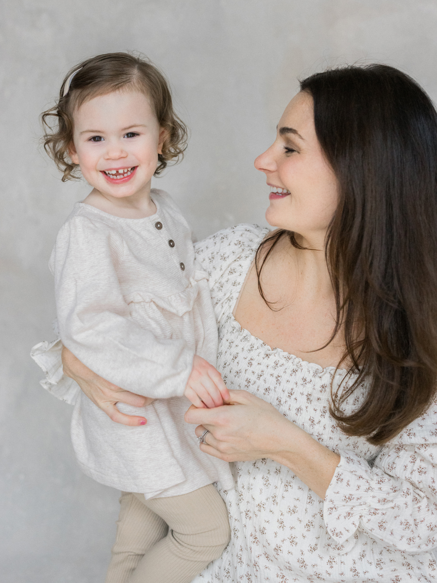 Millie shares a quiet, heartfelt moment with her mom during their Columbia Missouri Newborn Photography session - Love Tree Studios.