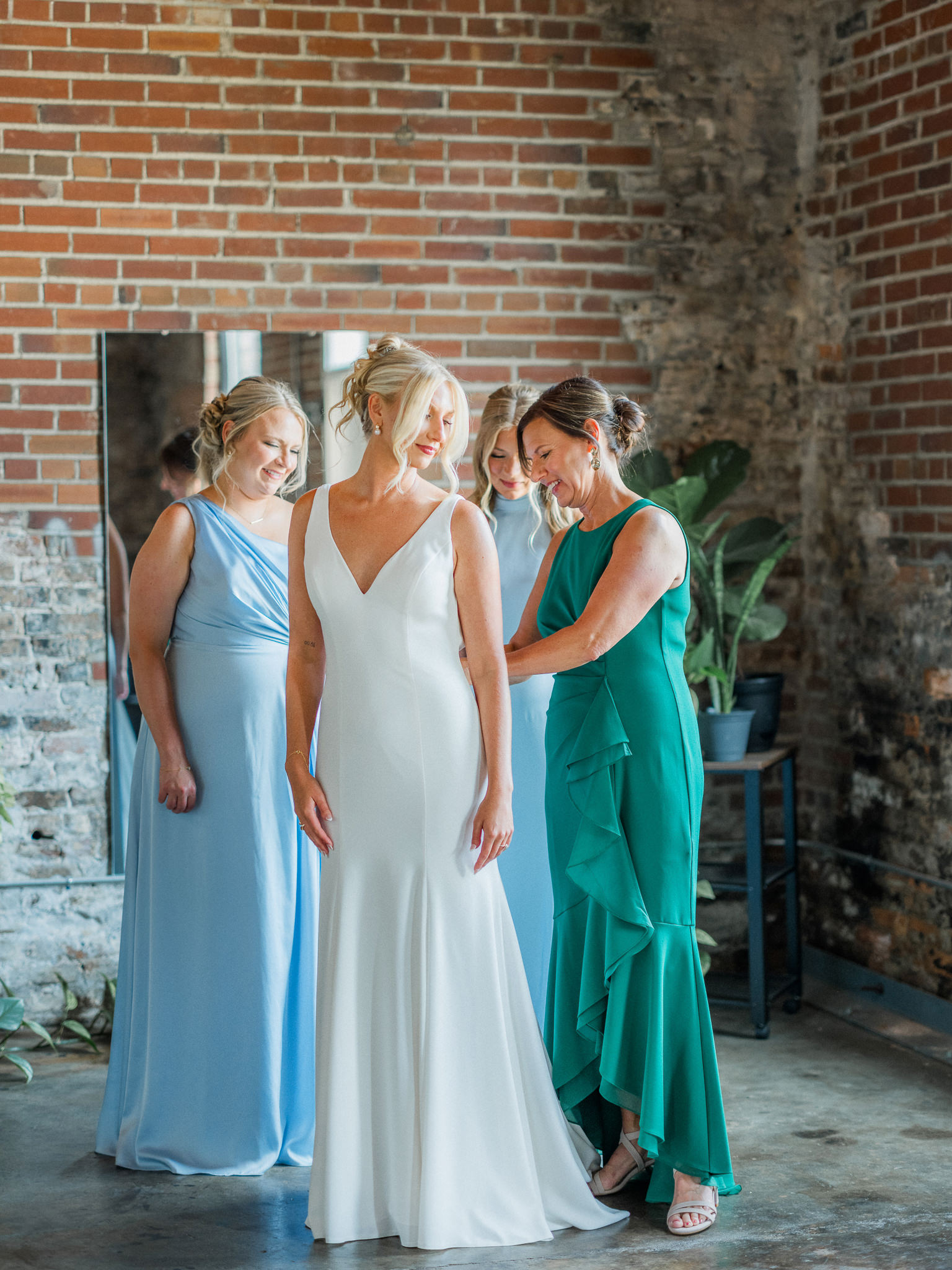 Bride and mother during final moments of getting ready captured by Love Tree Studios for Jefferson City wedding photography in Jefferson City, Missouri