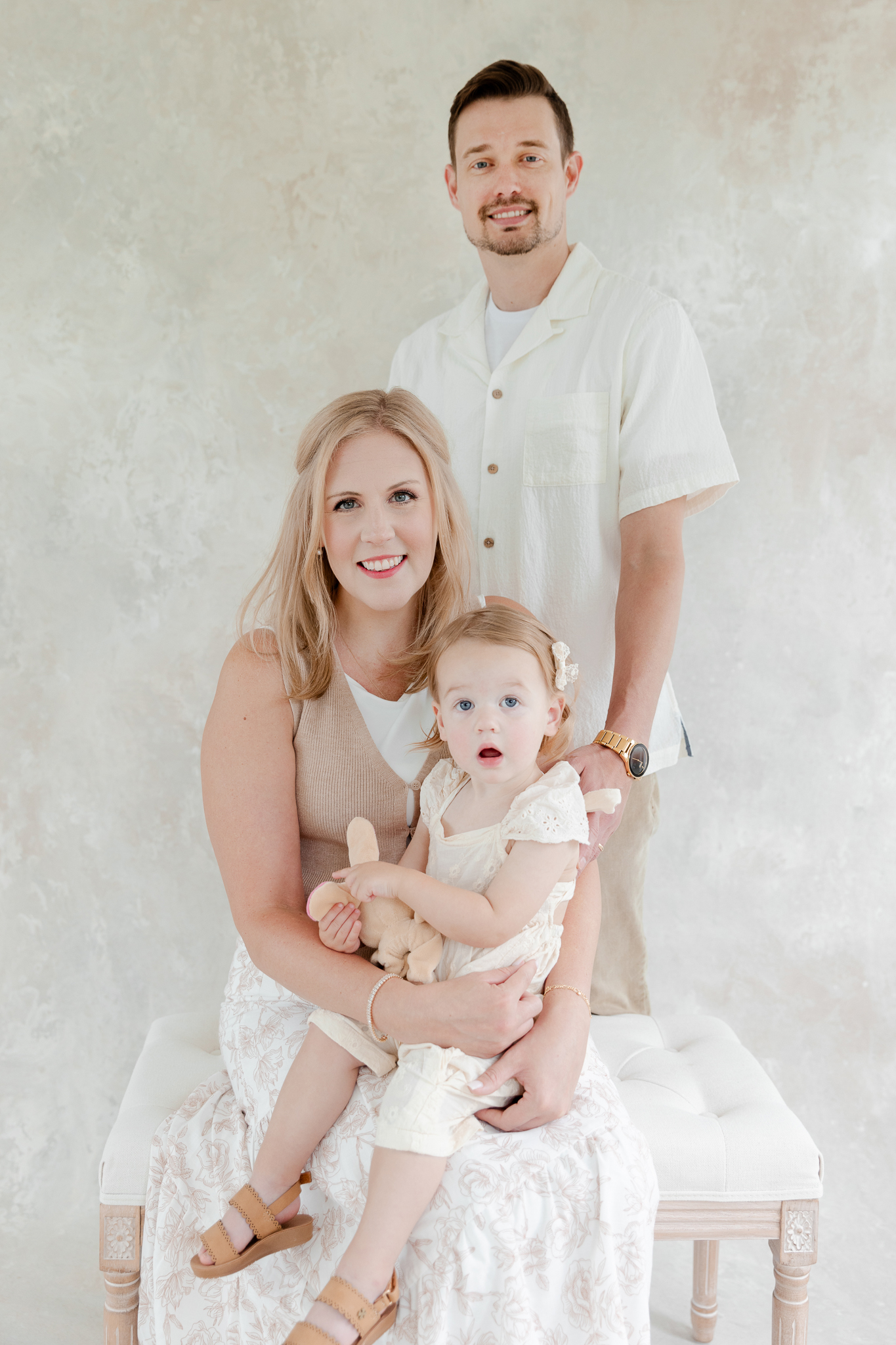 Timeless studio family photo of the Bradley family with their daughter Parker at Love Tree Studios in Columbia, Missouri.