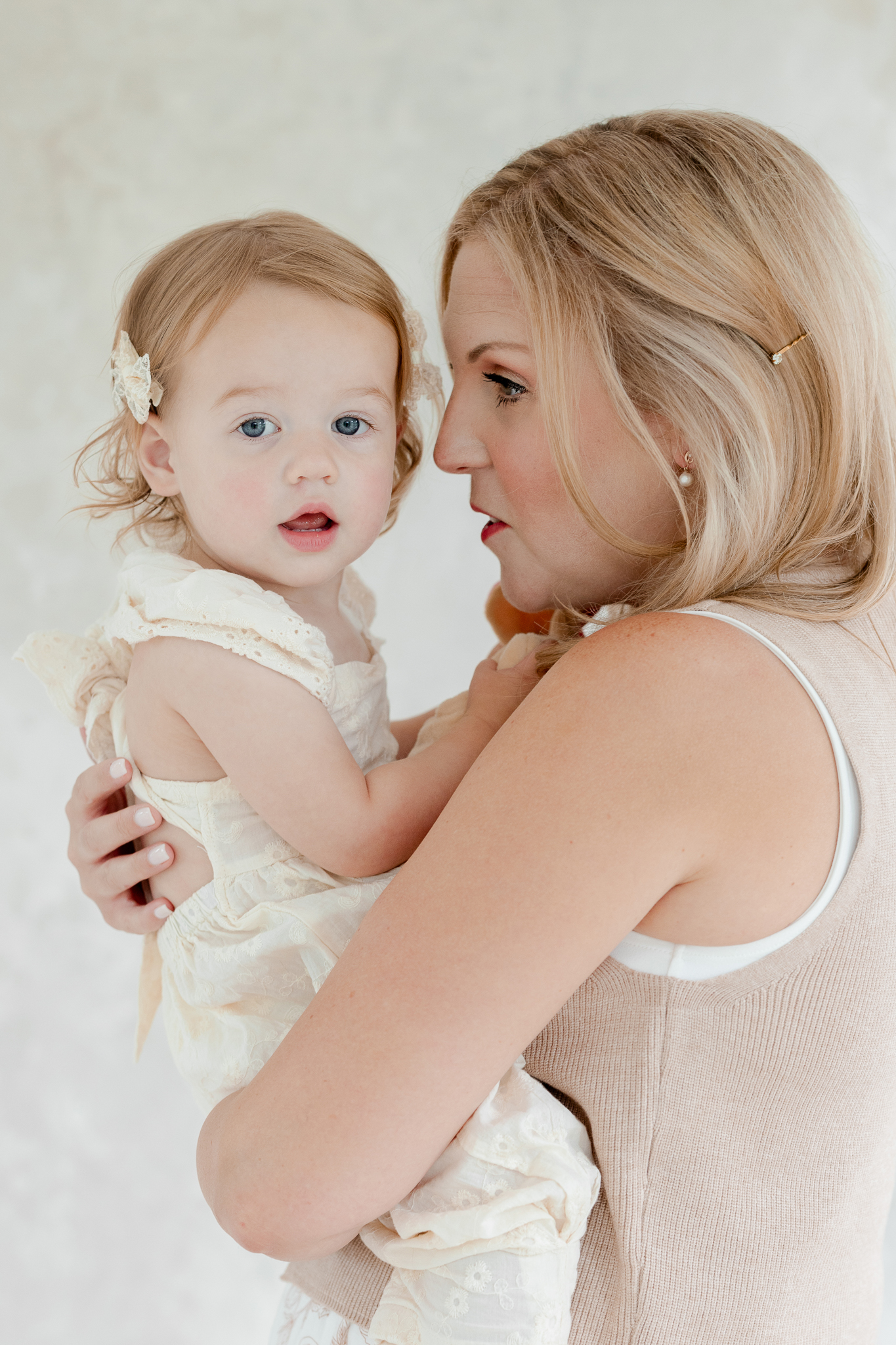 Intimate mother-daughter moment from the Bradley’s studio family photos Missouri at Love Tree Studios.