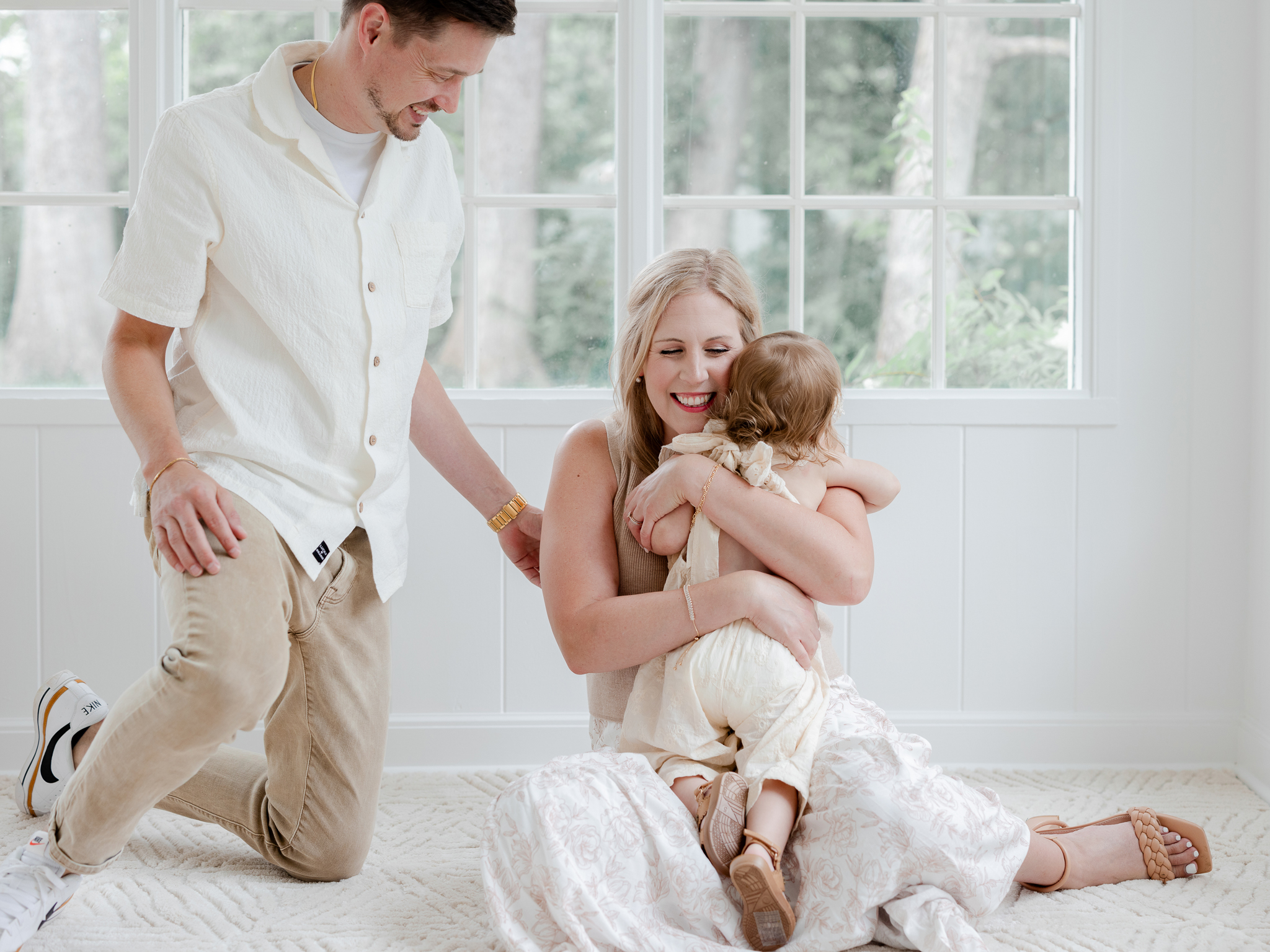 Playful moment during the Bradley family's studio family photos Missouri with Love Tree Studios in Columbia, Missouri.

