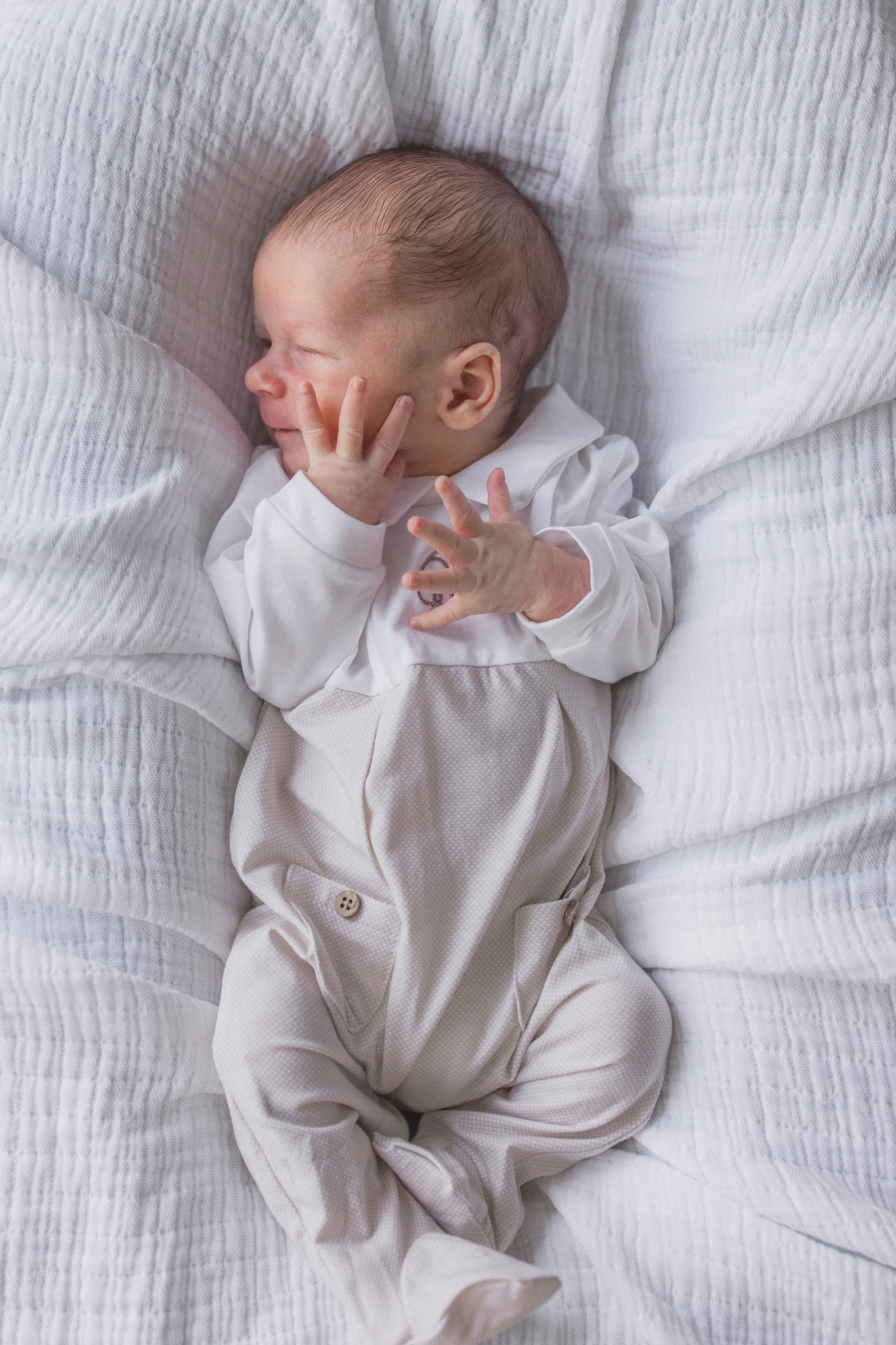 Close-up of baby Win swaddled and sleeping peacefully during a Columbia Missouri newborn session.