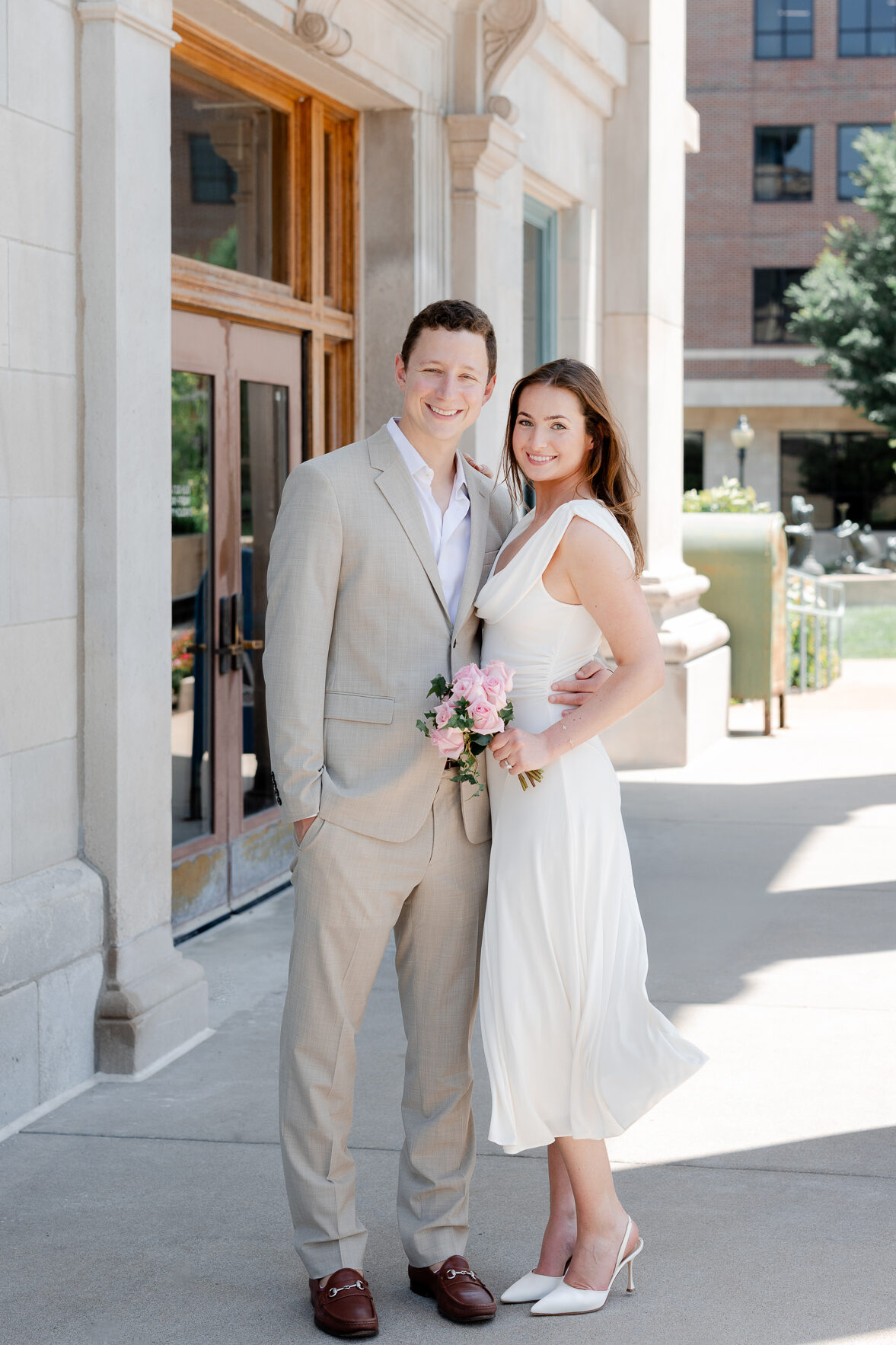 Classic bridal portrait of Arthur and Madison smiling at the camera outside the courthouse – Love Tree Studios capturing their courthouse wedding in Columbia Missouri.