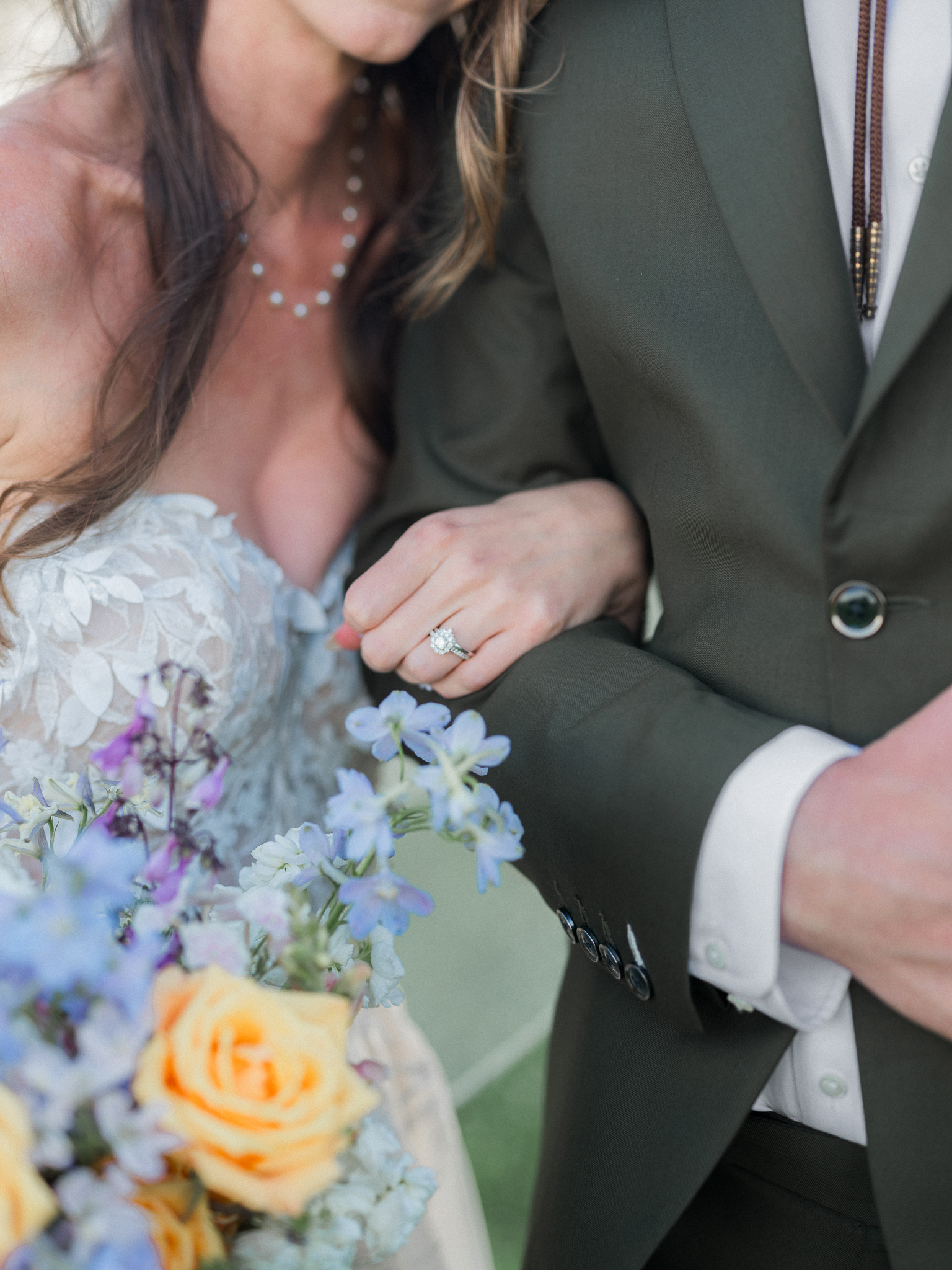 Close-up of her bouquet and ring—timeless touches from this elegant Blue Bell Farm wedding.