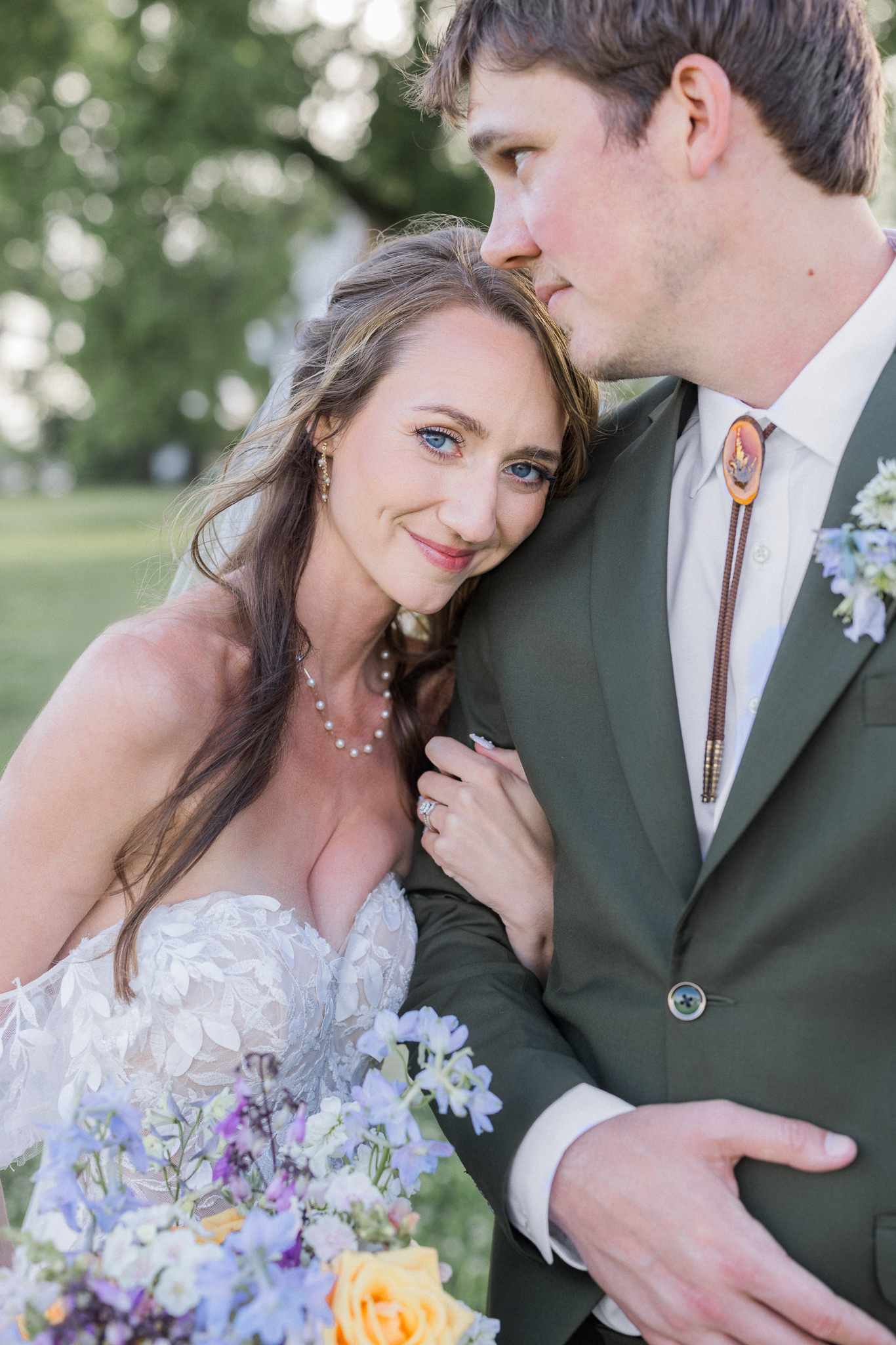 A quiet moment during portraits, full of love and laughter at this heartfelt Blue Bell Farm wedding.
