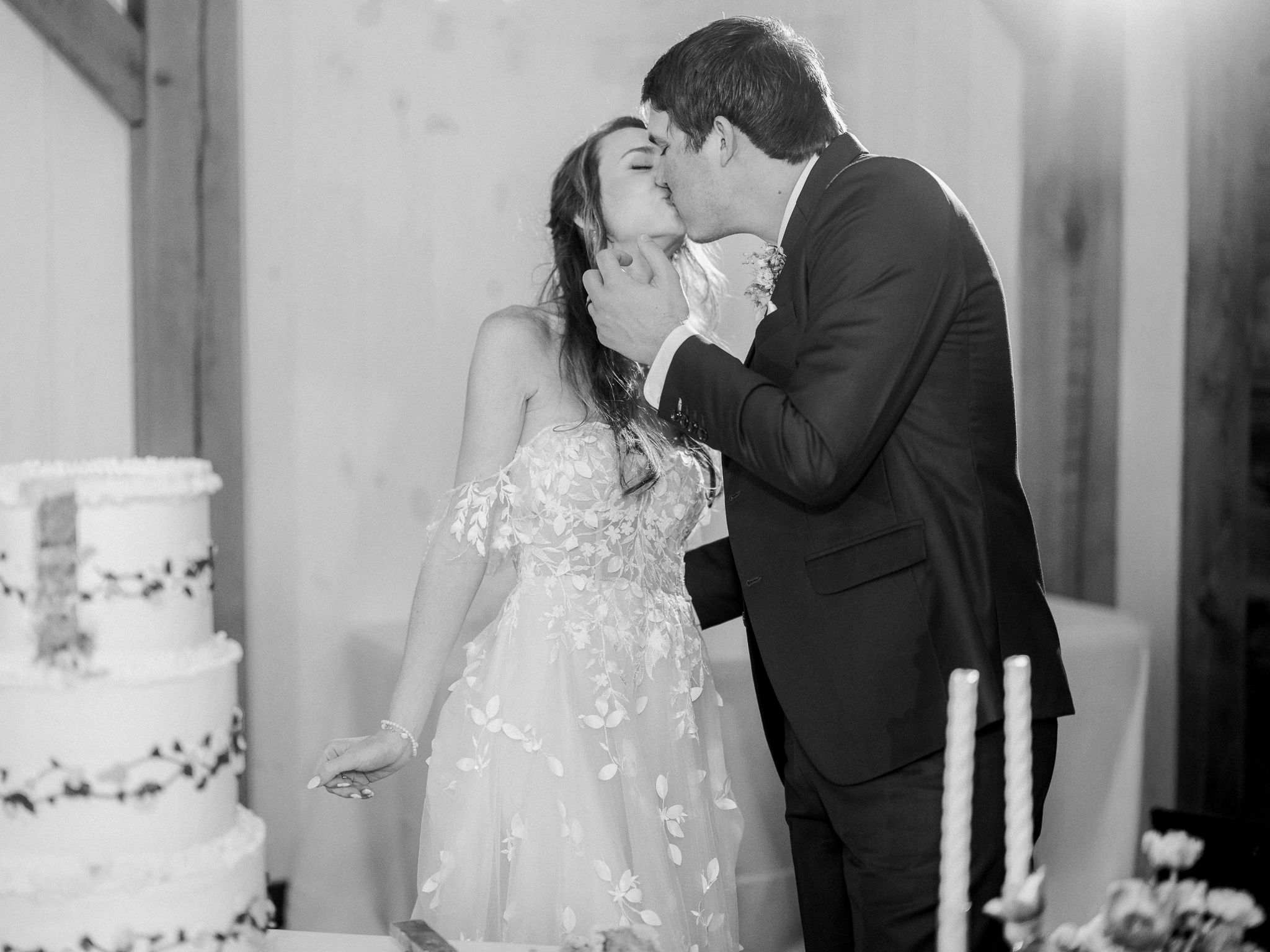 Sealed with frosting and a kiss — a perfect wedding moment.