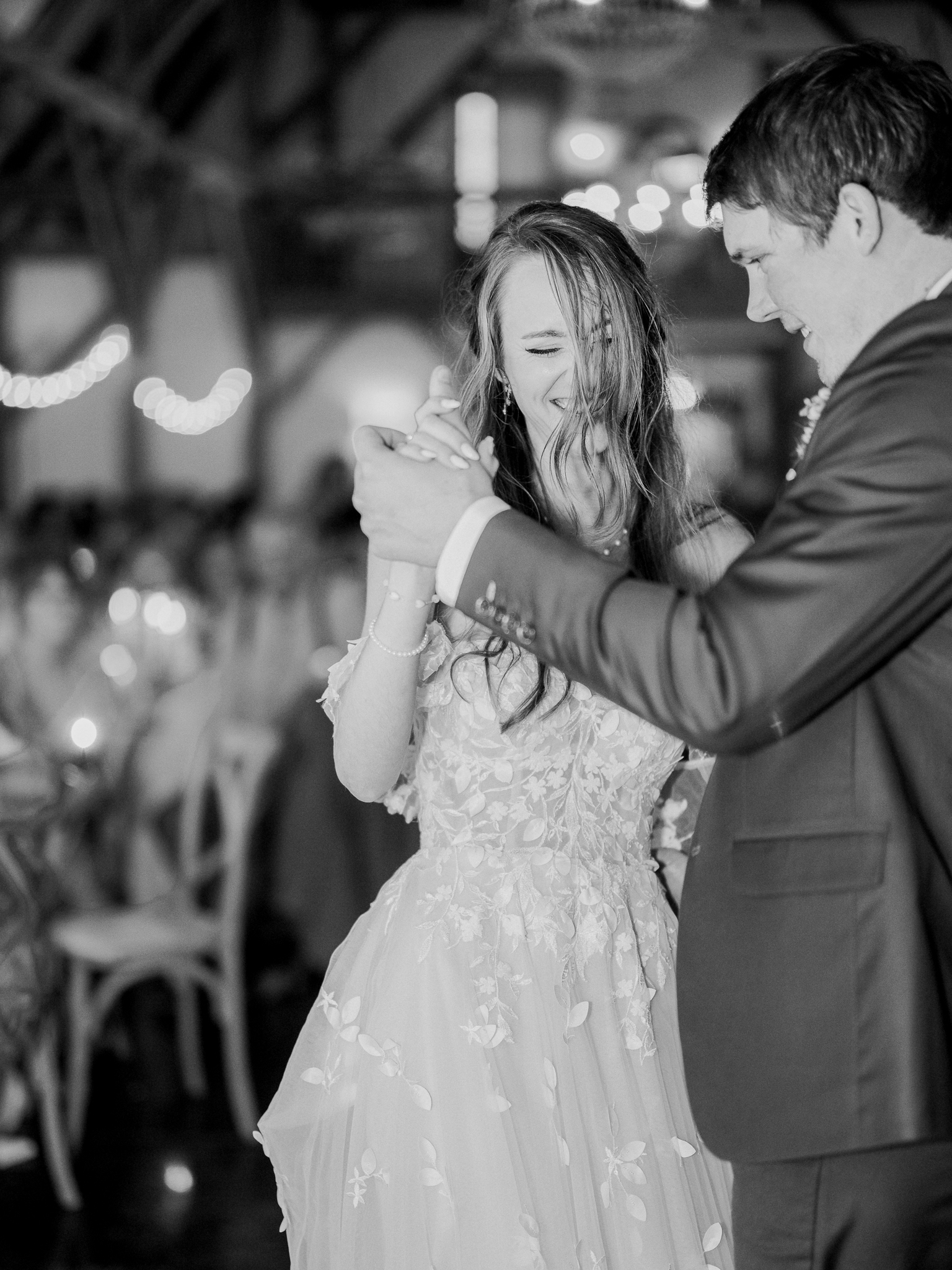 Jenny and Cooper share laughter and connection during their first dance at their Blue Bell Farm wedding.