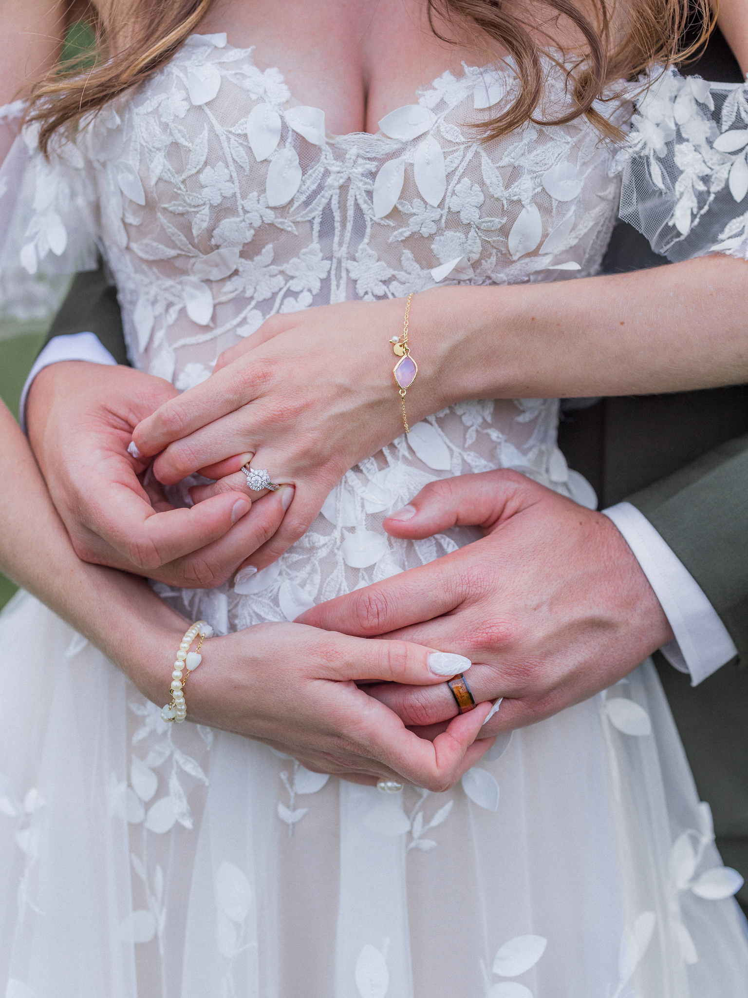Close up of the bride and groom's hands and rings at their Blue Bell Farm wedding photographed by Love Tree Studios.