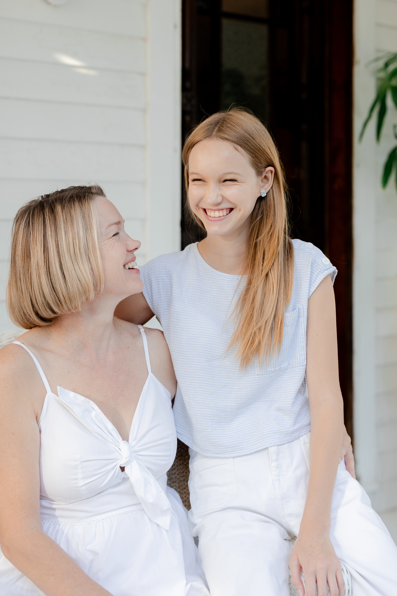 Mother and daughter laughing together, captured by Love Tree Studios family photography.