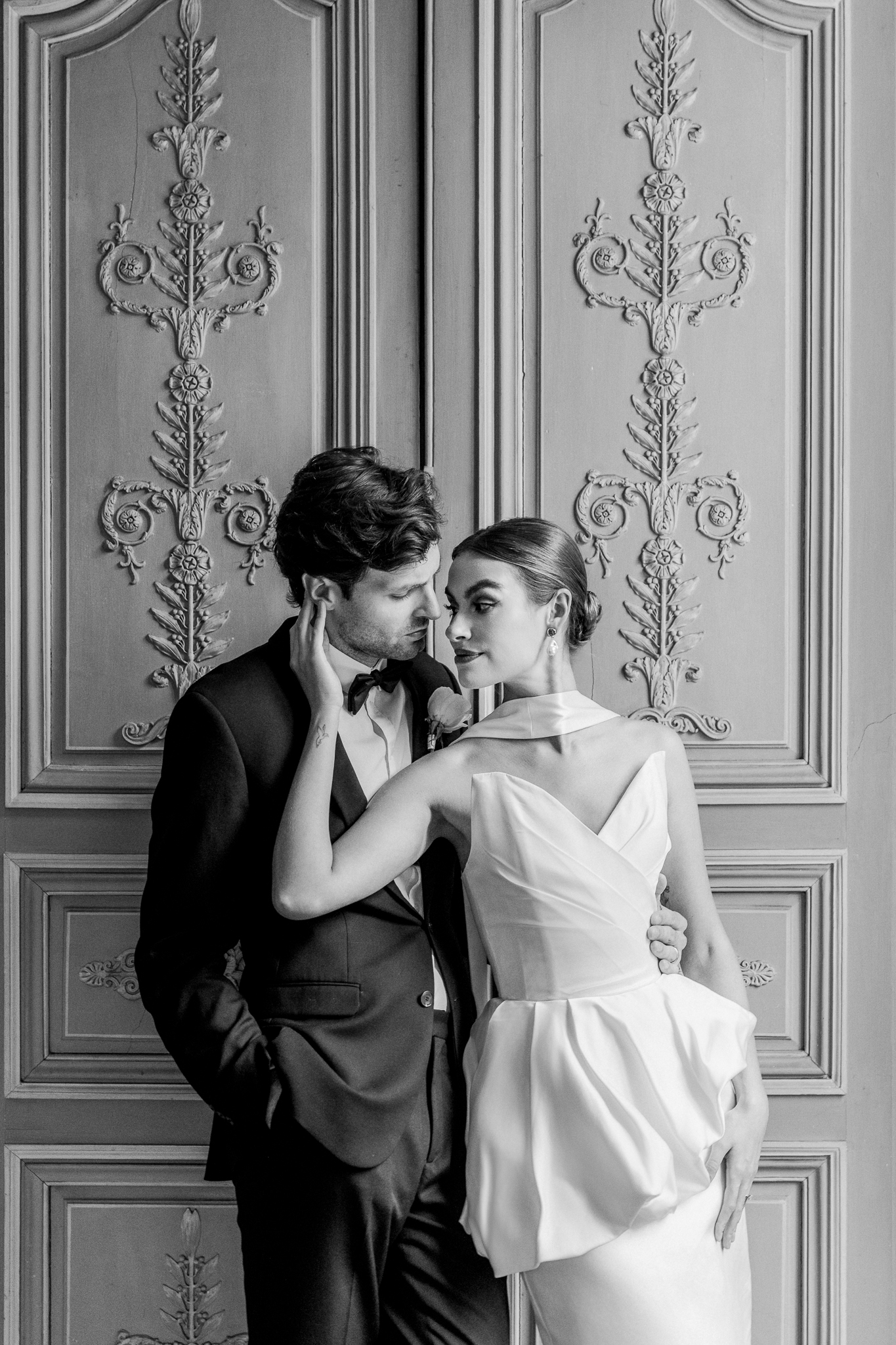 Artistic black and white portrait of the couple sharing a quiet moment inside Château de Thauvenay, captured in fine-art wedding style by Love Tree Studios.