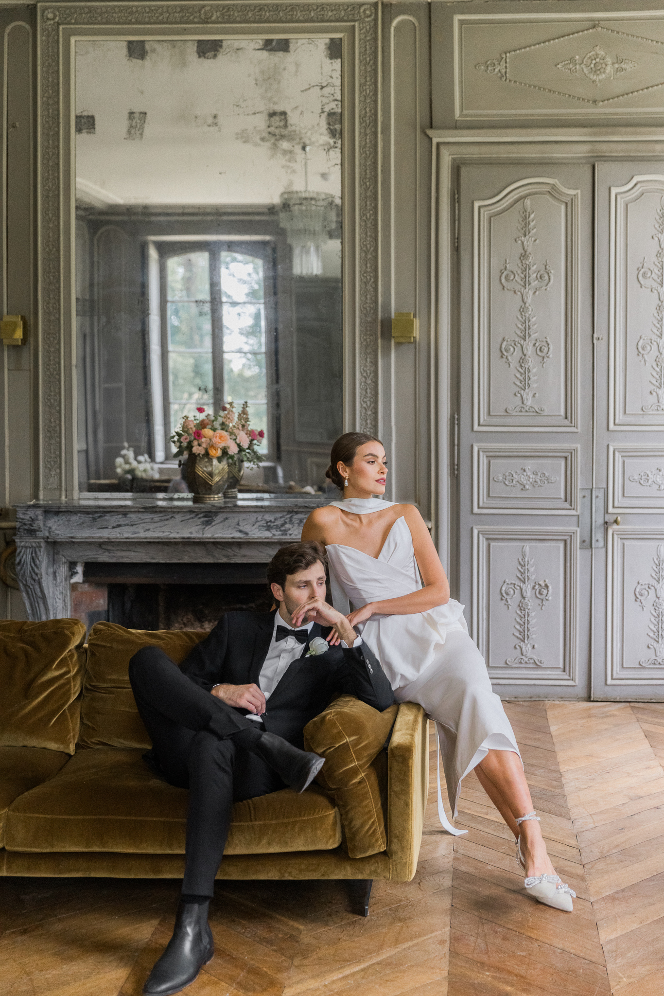 Editorial portrait of bride and groom in a stately room at Château de Thauvenay, styled with vintage French decor and captured by Love Tree Studios in Sancerre, France.