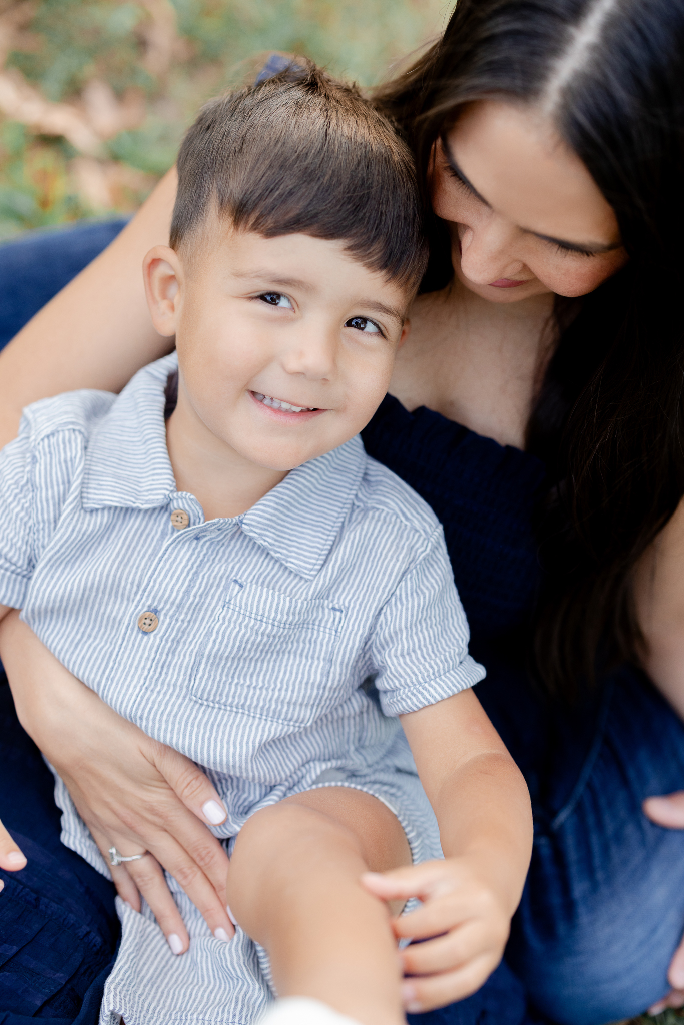 Mother holding her son in a tender moment during their fall family session in Columbia Missouri.