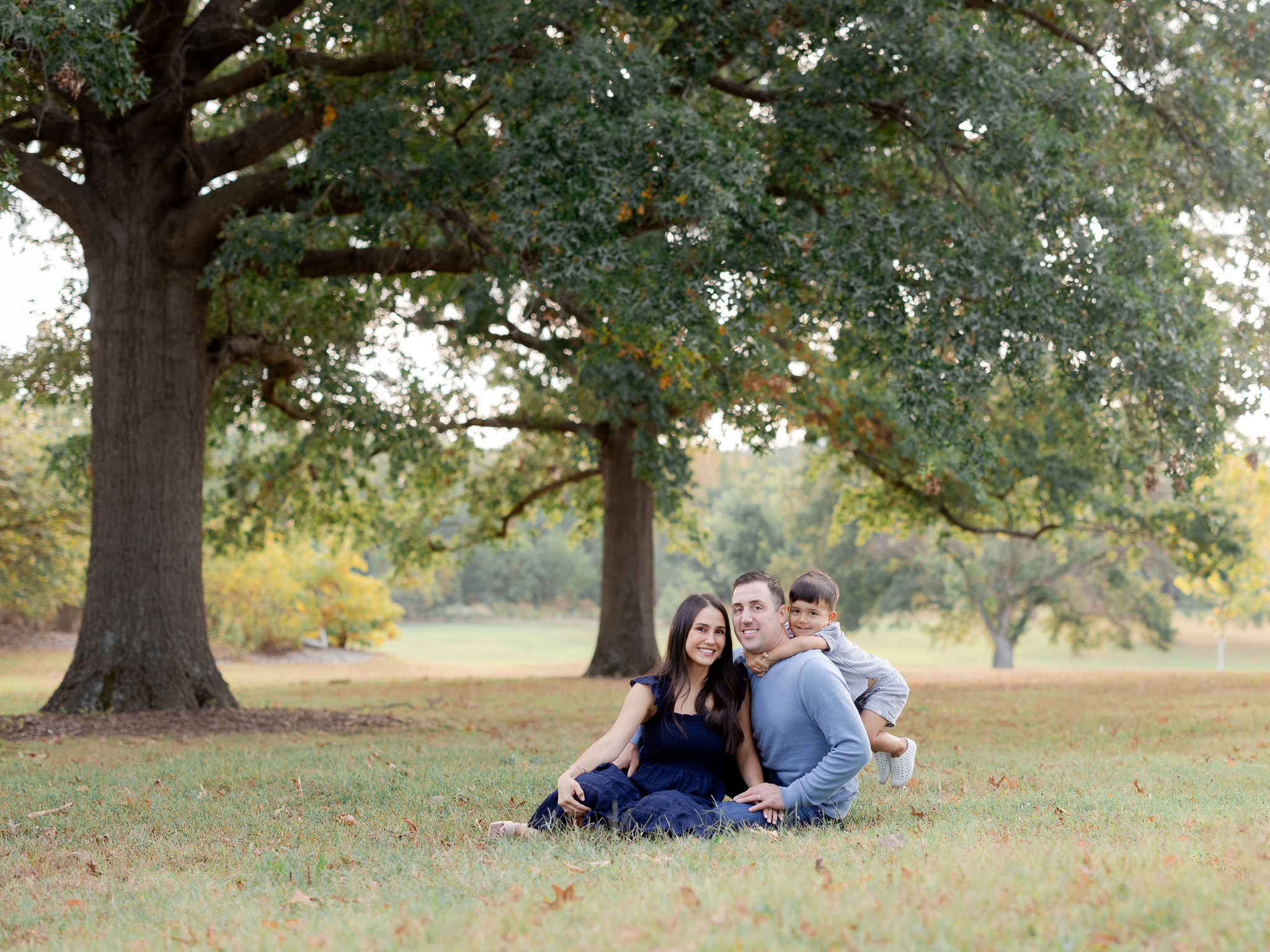 Love Tree Studios captures a joyful family moment in Columbia Missouri with fall colors and soft morning light.