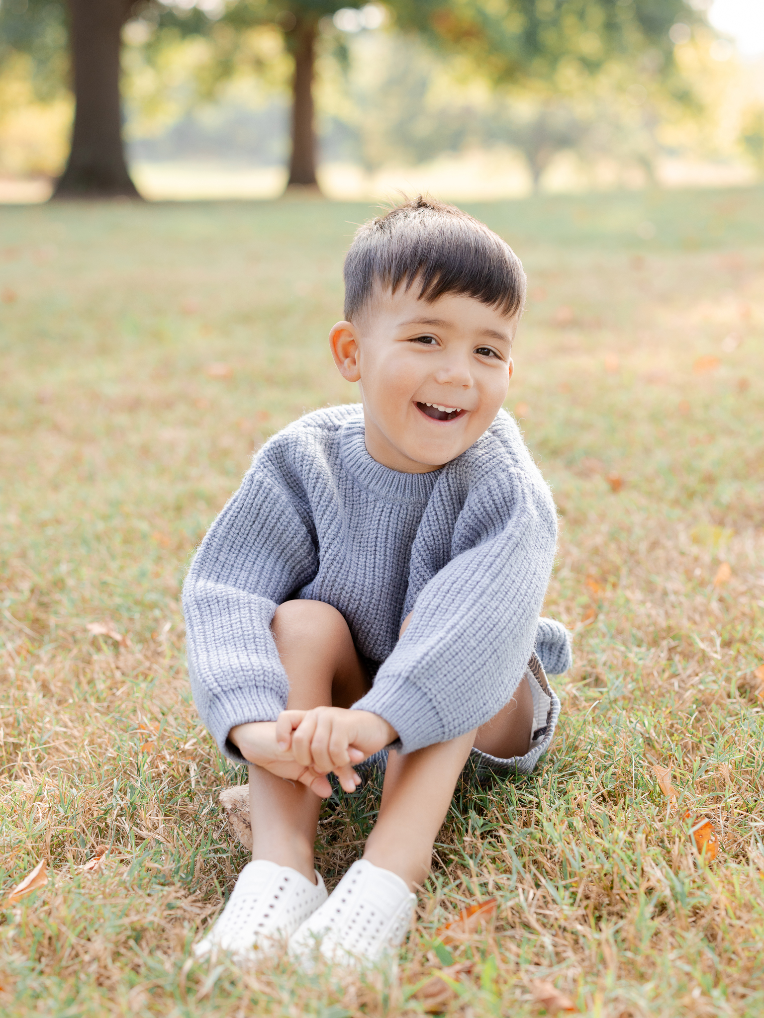 Beautiful portrait of a boy in golden morning light at Stephens Lake Park, captured by Love Tree Studios.