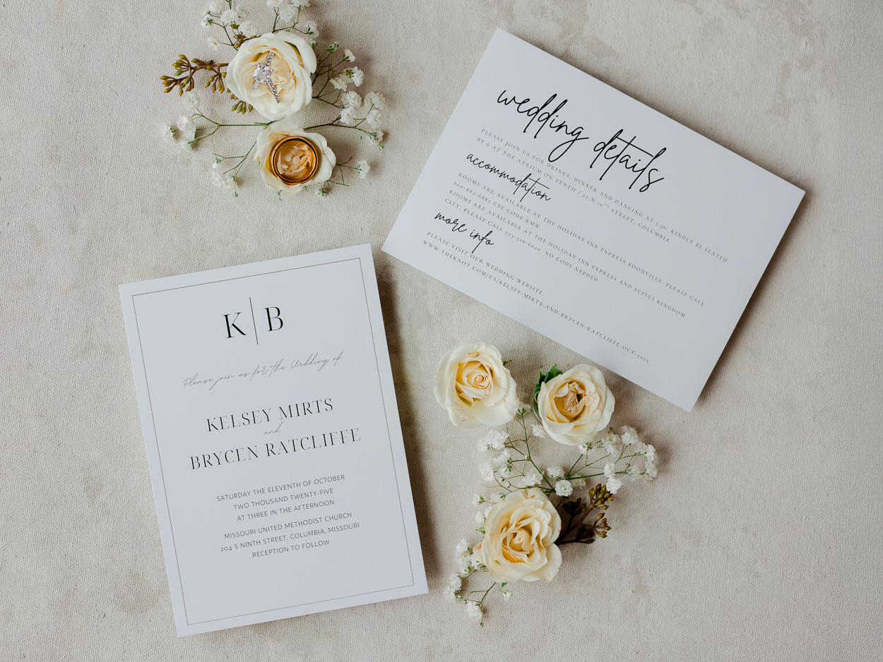 Black and white wedding invitation suite with ivory roses and baby’s breath for a timeless Columbia Missouri church wedding.