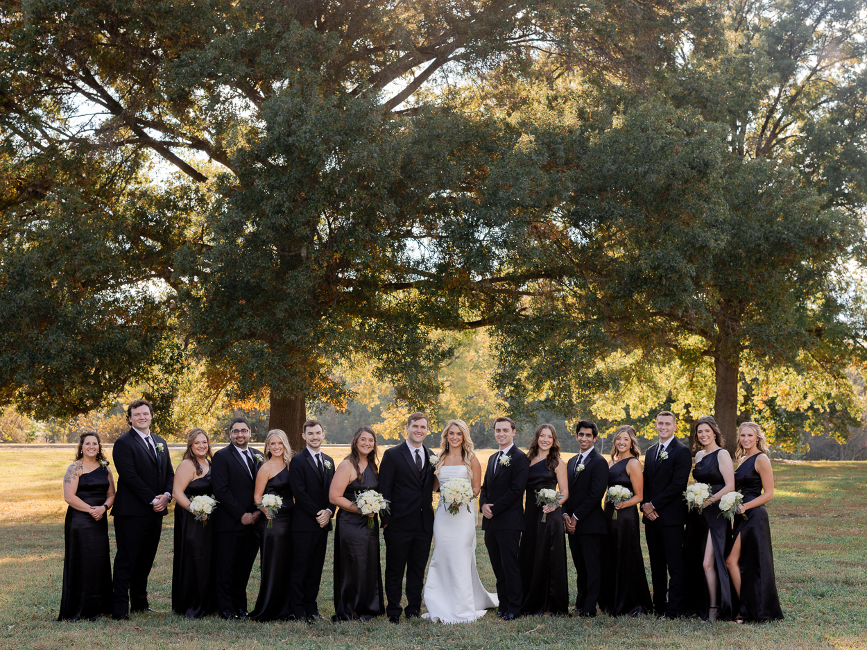 Wedding party portrait at Stephens Lake Park during golden hour after a Columbia Missouri church wedding.