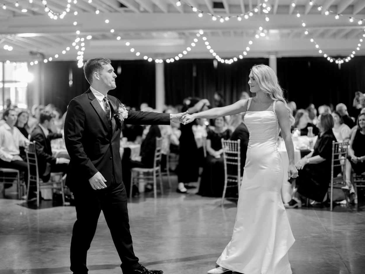 Bride and groom spinning across the dance floor during their reception in Columbia, Missouri.