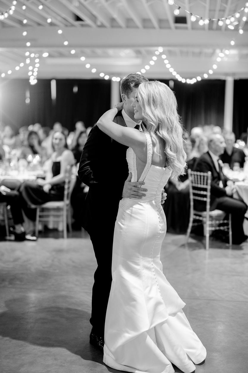 First dance beneath string lights at The Atrium on Tenth following a Columbia Missouri church wedding.