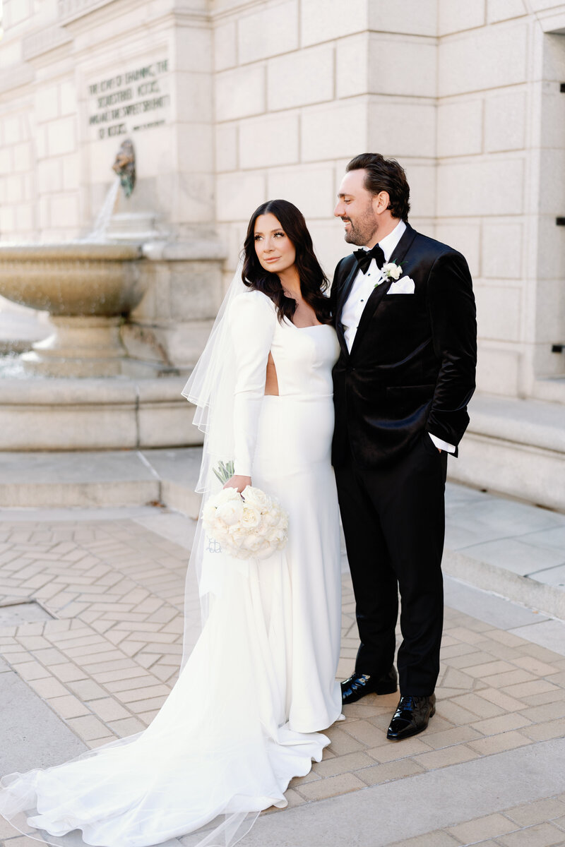 Bride and groom in front of a fountain, St. Louis wedding photography and film by Lauren Michele Productions.